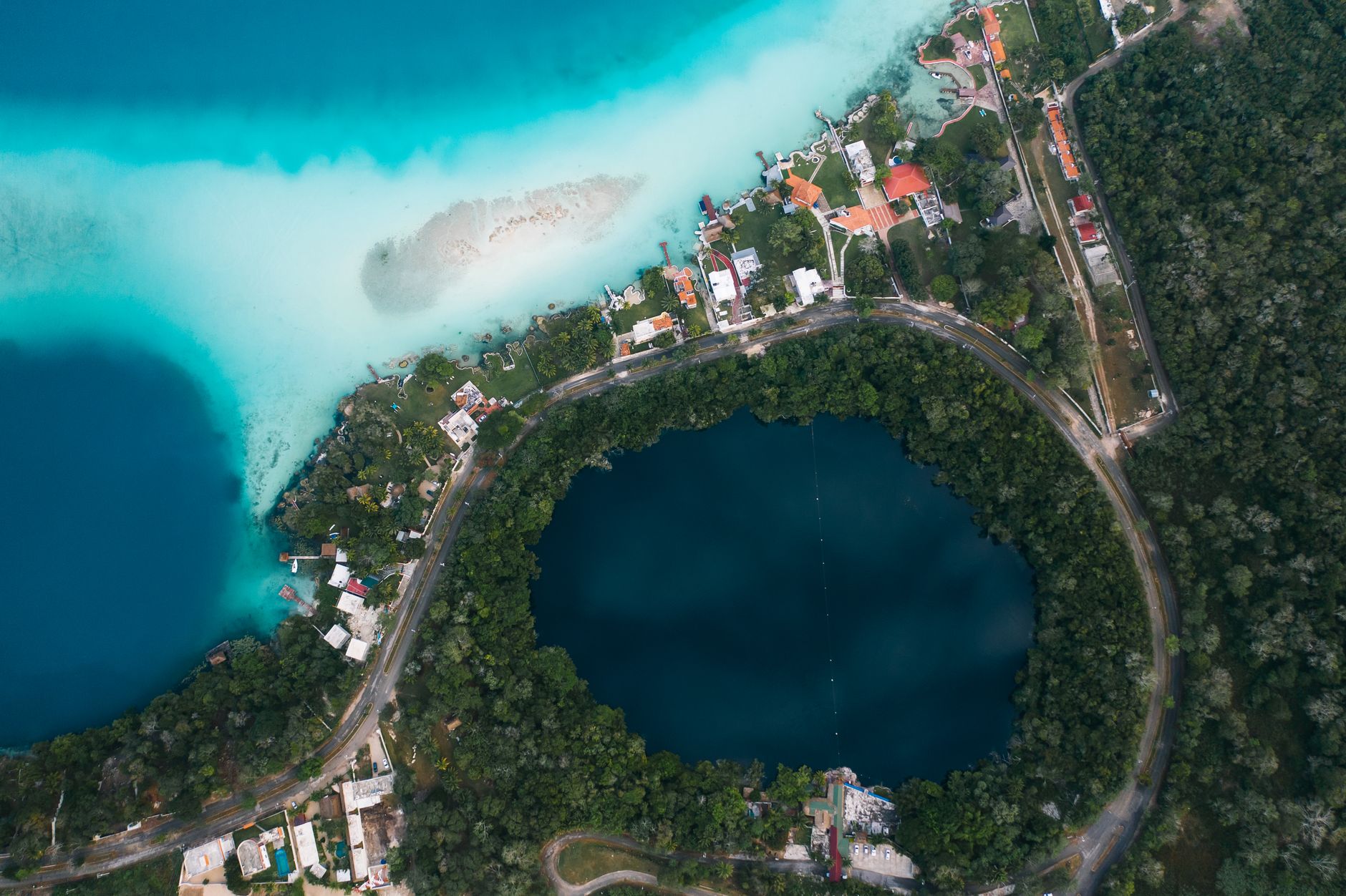 Stunning aerial view of Bacalar Lagoon in Quintana Roo, Mexico showcasing vibrant waters and nature.