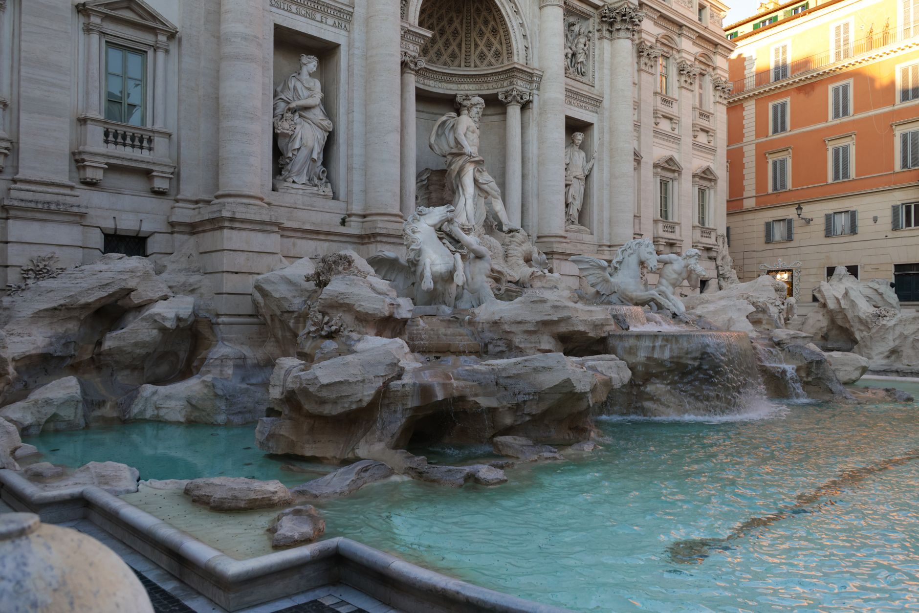 Captivating view of the Trevi Fountain in Rome, showcasing intricate sculptures and turquoise waters.