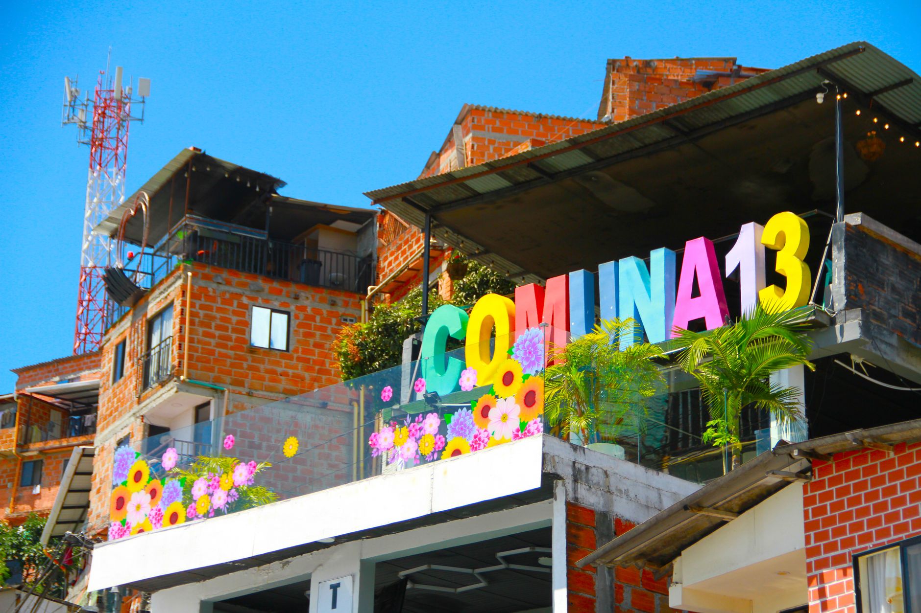 Vibrant street art in Comuna 13, Medellin showcases urban culture and tourism appeal.