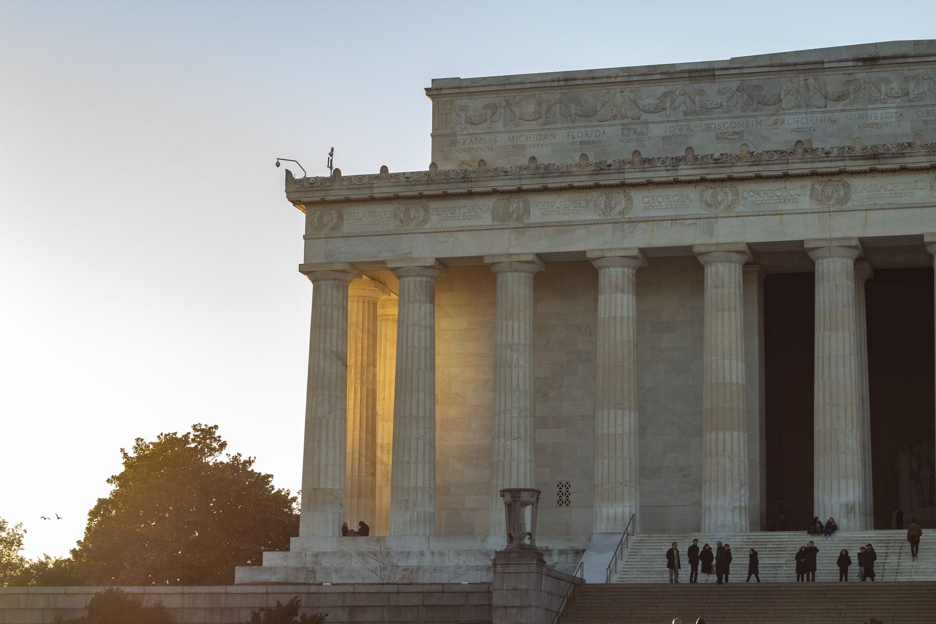 Elegant view of Lincoln Memorial's iconic columns during sunset in Washington DC.