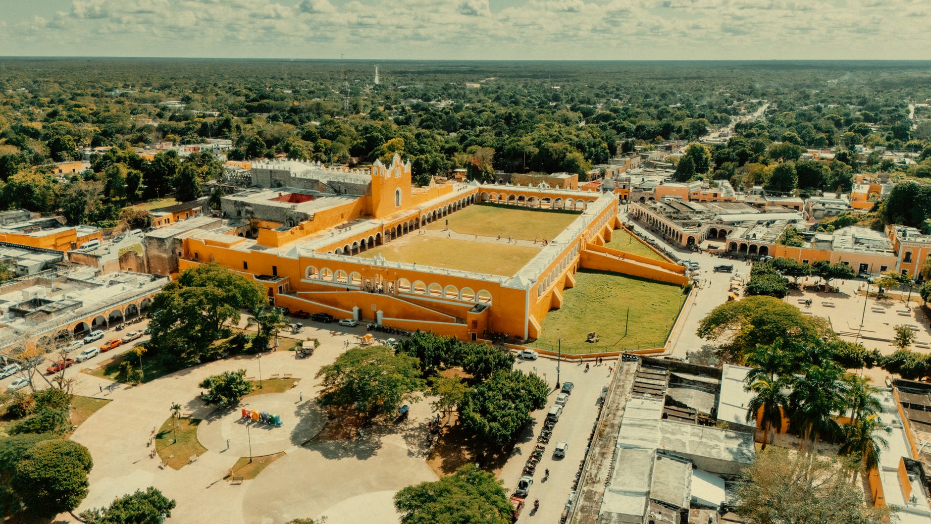 Stunning aerial view of the iconic yellow Convento de San Antonio de Padua in Izamal, Mexico.