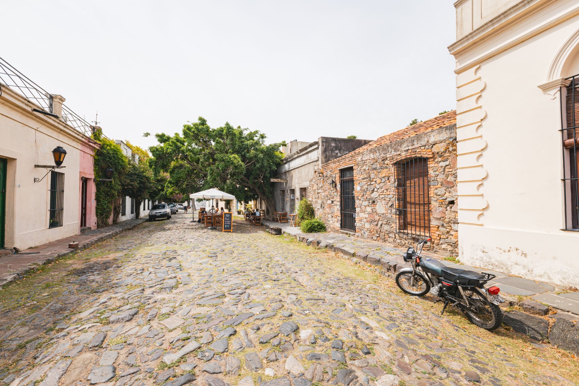 Explore the historic charm of a cobblestone street in Colonia, Uruguay, showcasing unique architecture.