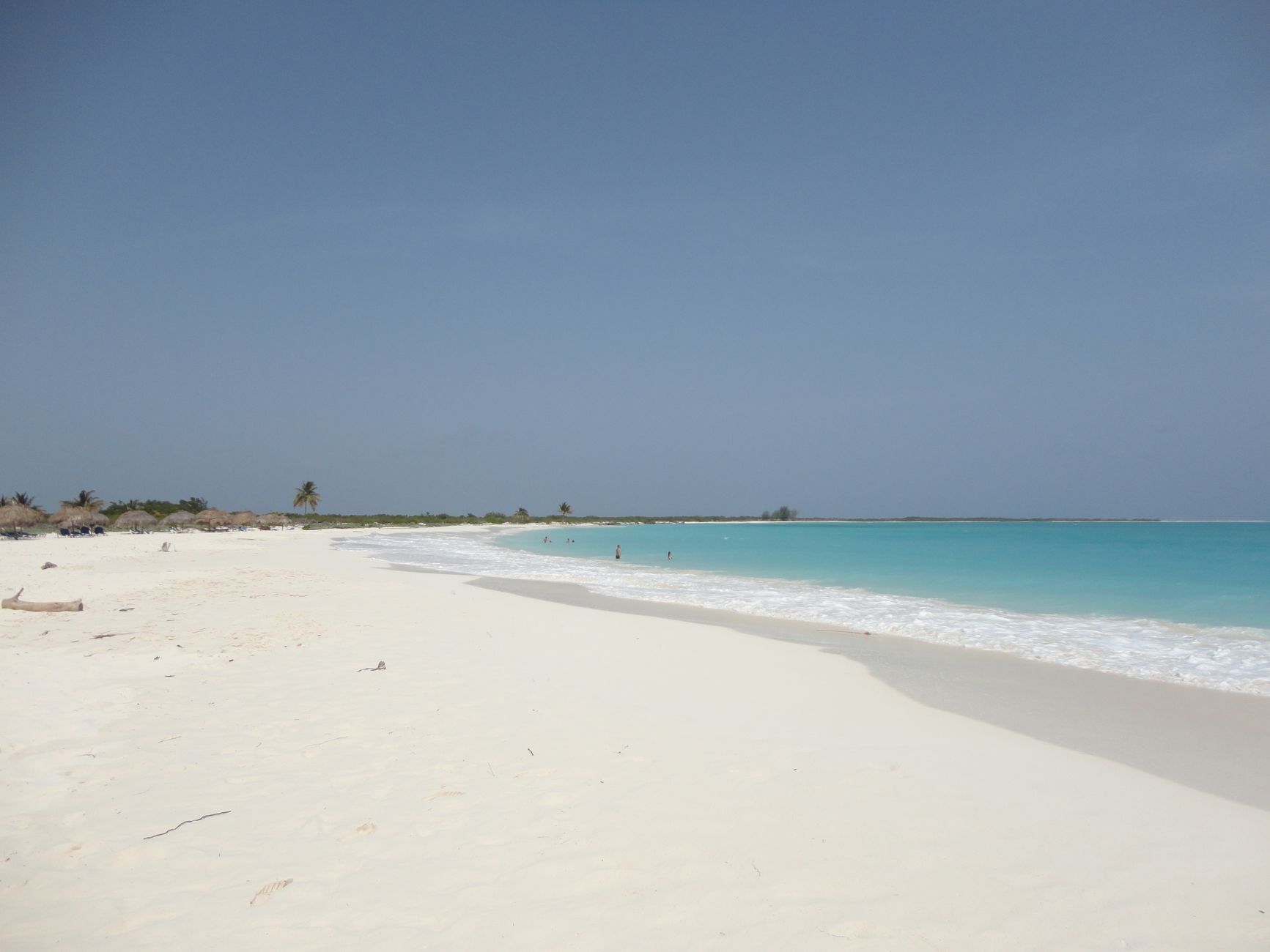 Experience the serene beauty of Cayo Largo's unspoiled beach with azure waters and soft white sand.