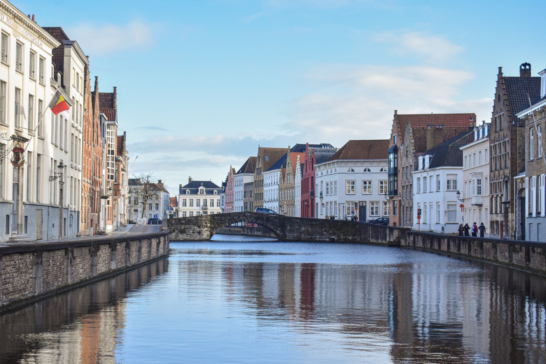 Picturesque view of the canal and historic buildings in Bruges, Belgium.