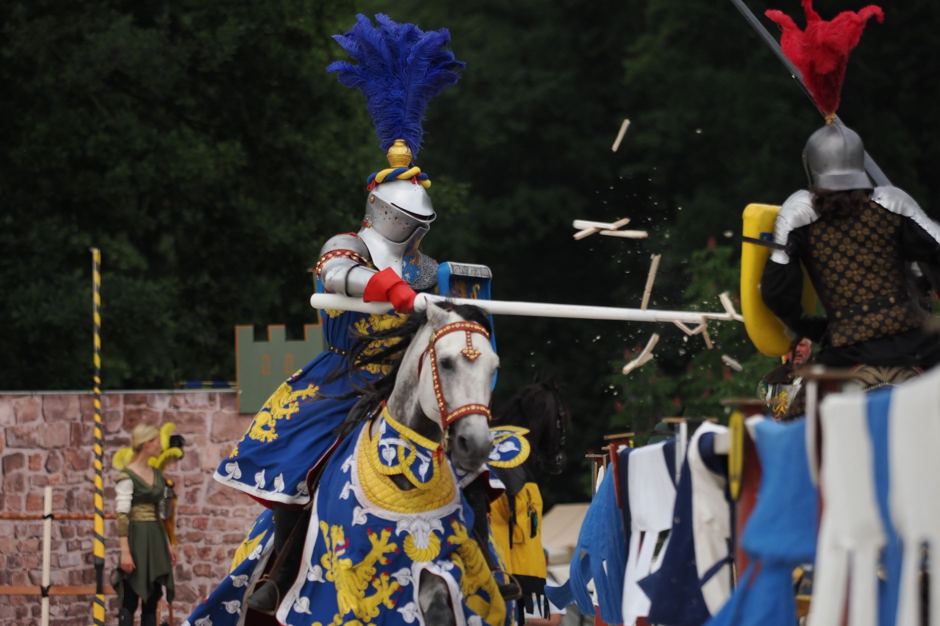 Dramatic clash between knights in a colorful medieval jousting event.