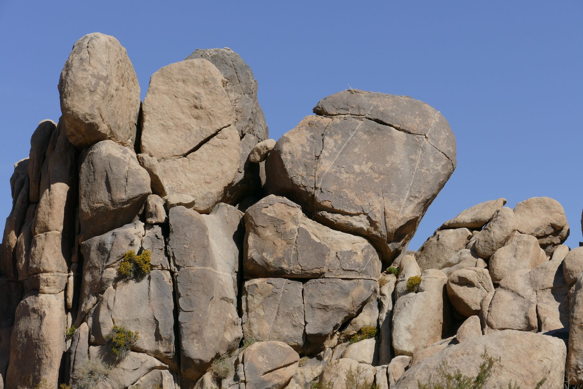 Stunning rock formations under a clear blue sky in Palm Springs, California.