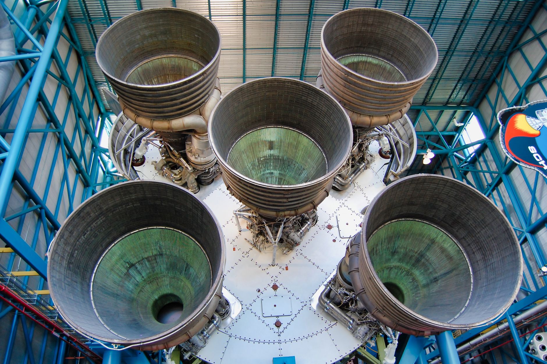 Detailed view of Saturn V rocket engines at Kennedy Space Center, showcasing engineering marvel.