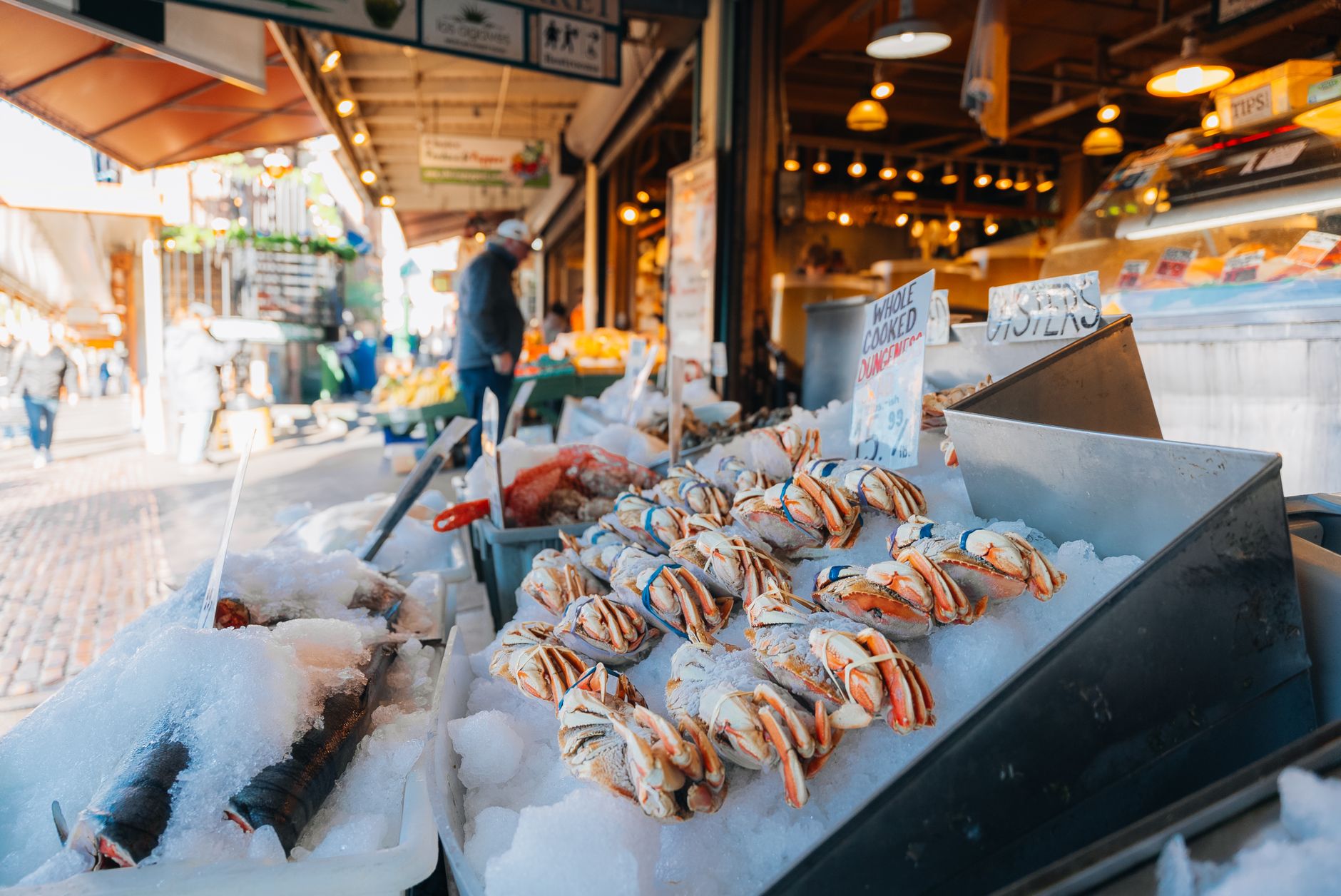 Fresh seafood and crabs on ice at Seattle's iconic Pike Place Market.